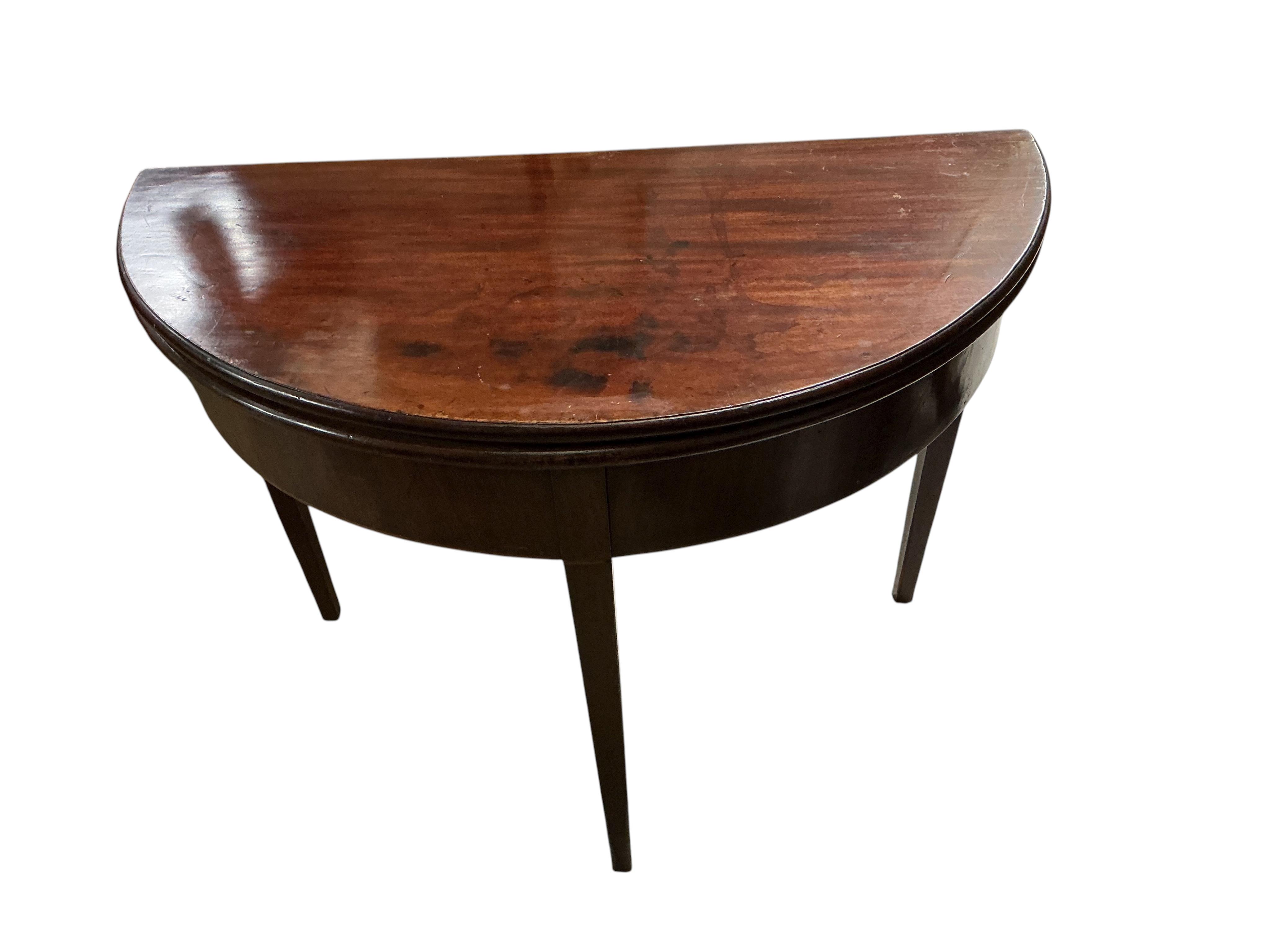 A George III mahogany demi-lune folding tea table, width 94cm, depth 46cm, height 73cm